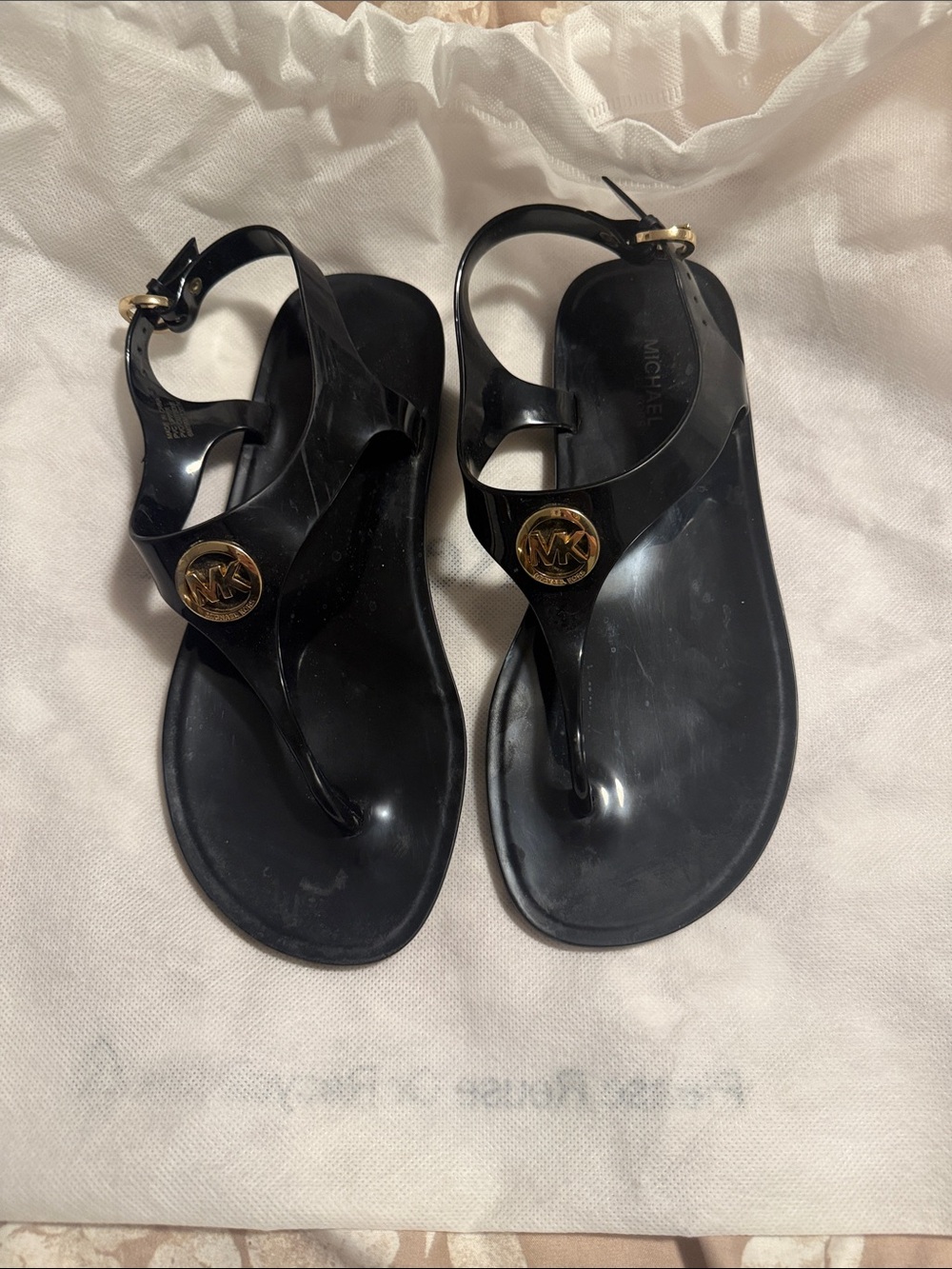 Michael Kors Black Jelly Thong Sandals with Gold MK Disc